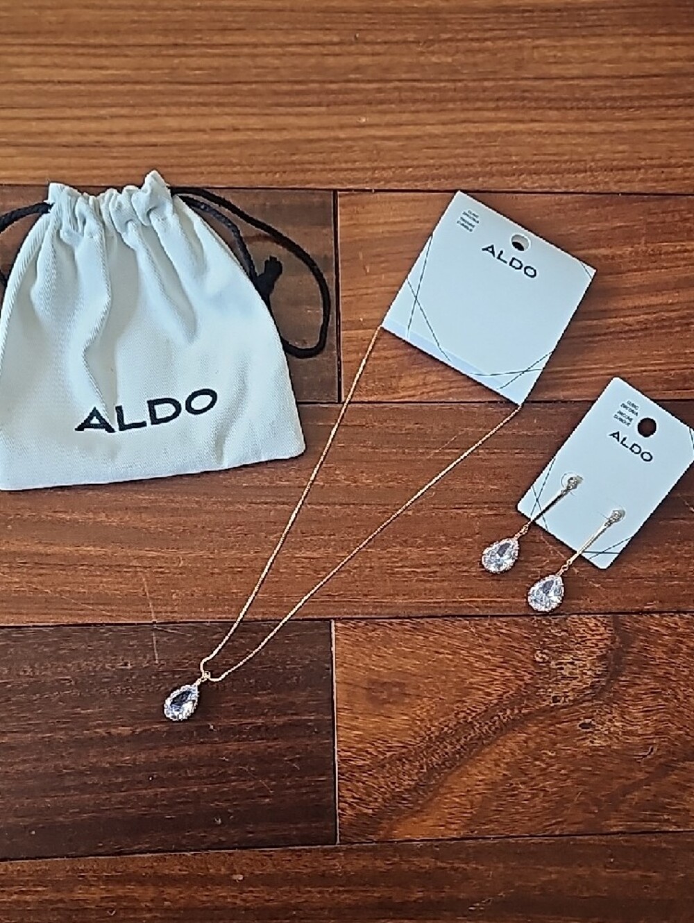 Aldo Gold Tone Necklace and Clear Teardrop Crystal Earrings Set - Picture 2 of 5
